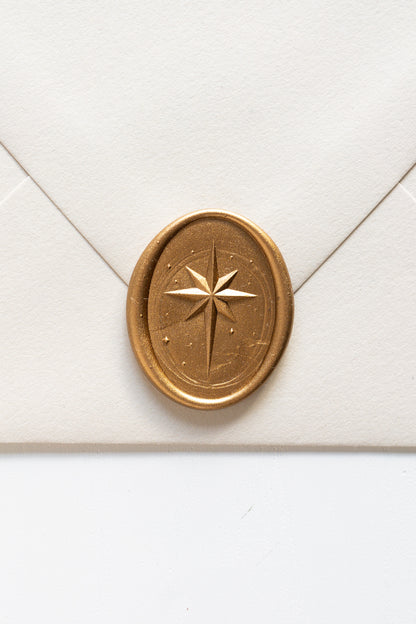 Gold star wax seal on cream envelope, elegant sealing wax detail for wedding invitations and holiday mail