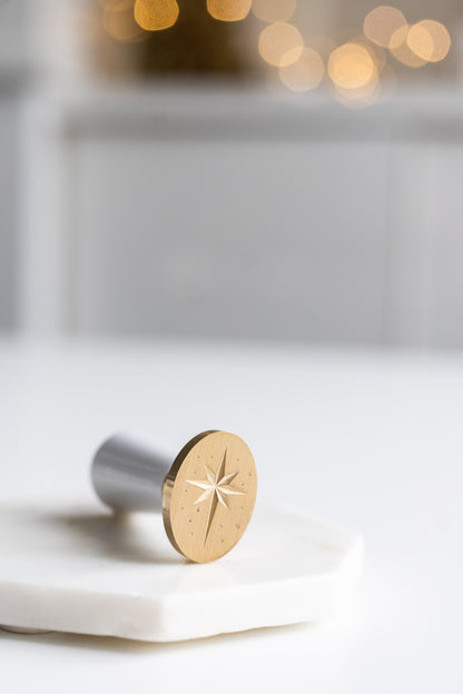 Brass wax seal stamp with star engraving on white surface, calligraphy wax seal tool for stationery