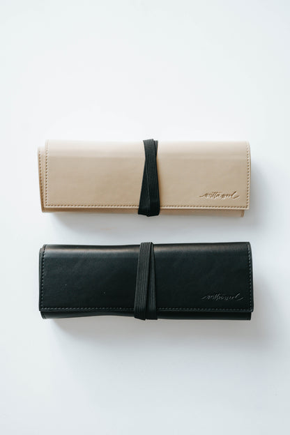 Beige and black calligraphy pen roll cases with elastic closure for storing oblique or straight penholders