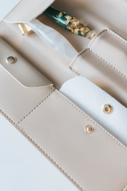 Beige calligraphy pen roll with oblique penholders stored in stitched compartments