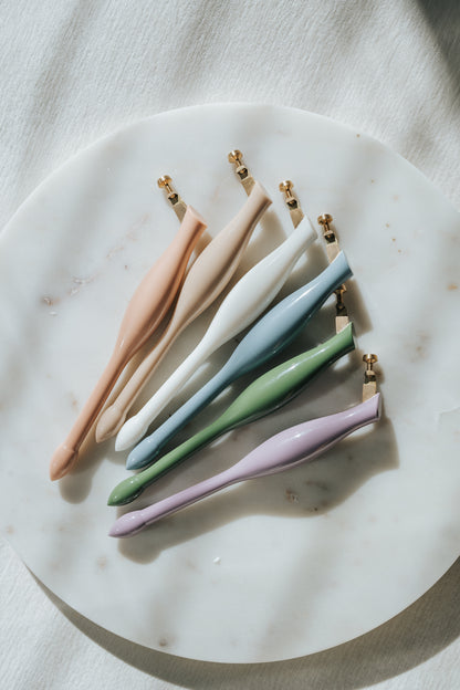Pastel universal calligraphy pen holders in multiple colors on marble, oblique pen set