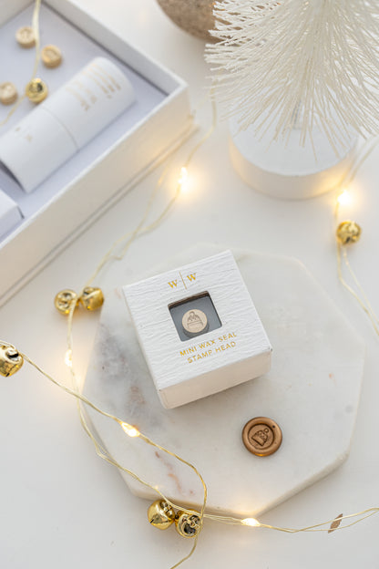 Boxed mini wax seal stamp with toque design and gold wax impression, part of Written Word Calligraphy’s Holiday Collection