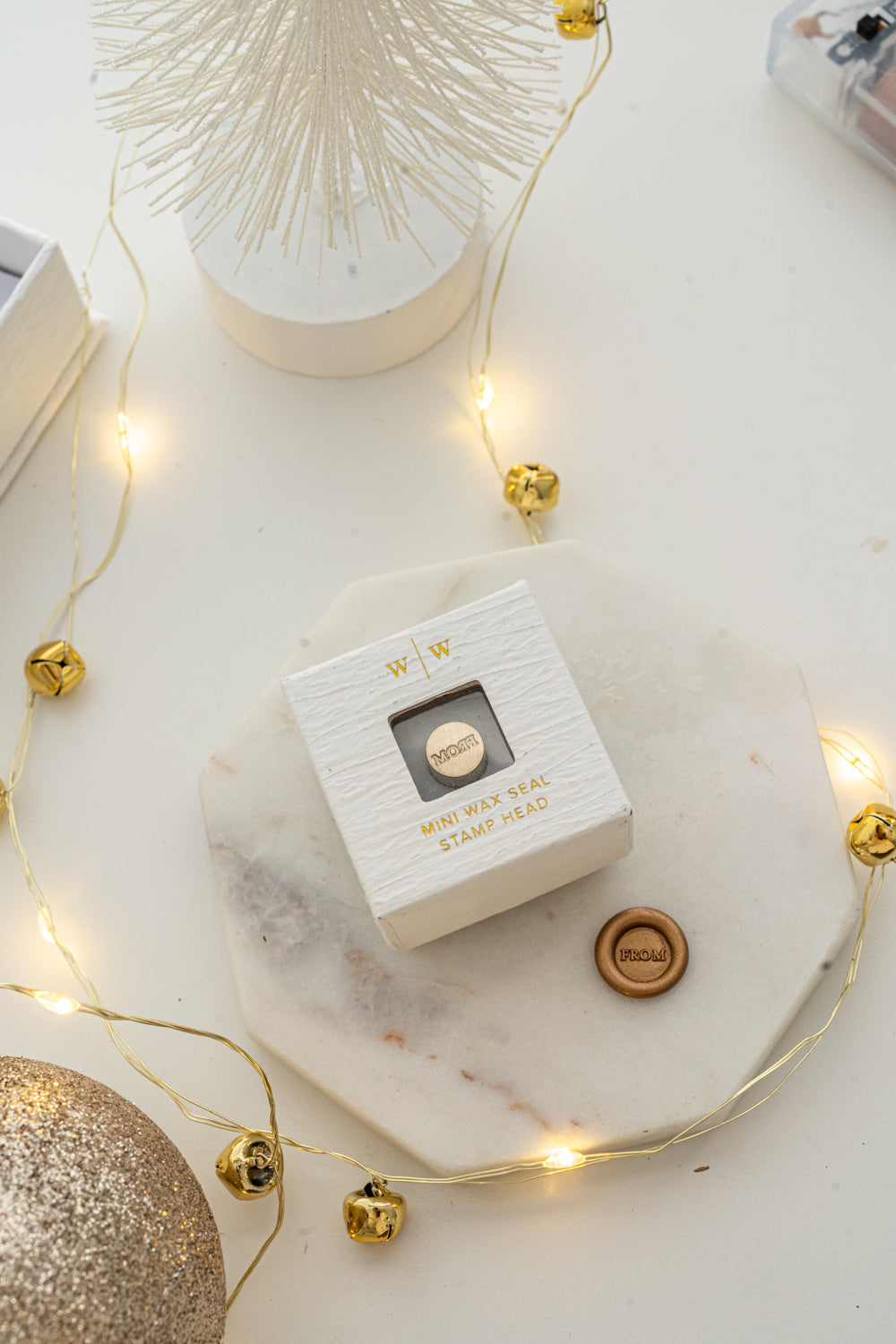 Boxed mini wax seal stamp with “FROM” design and gold wax impression, part of Written Word Calligraphy’s Holiday Collection.