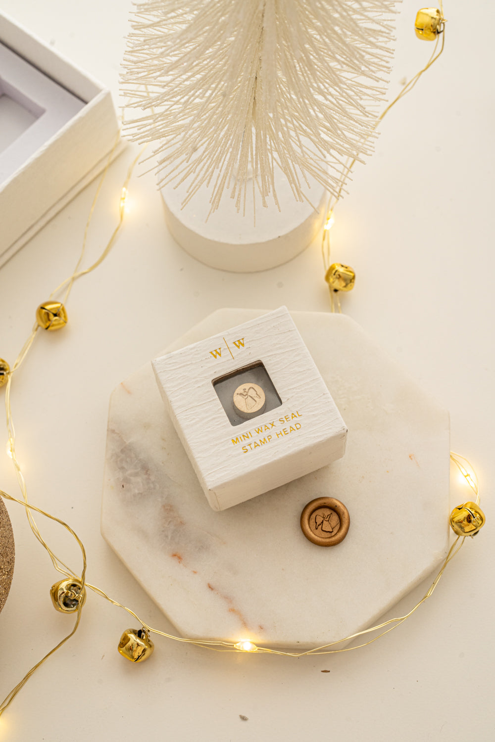 Boxed mini wax seal stamp with angel design and gold wax impression, part of Written Word Calligraphy’s Holiday Collection