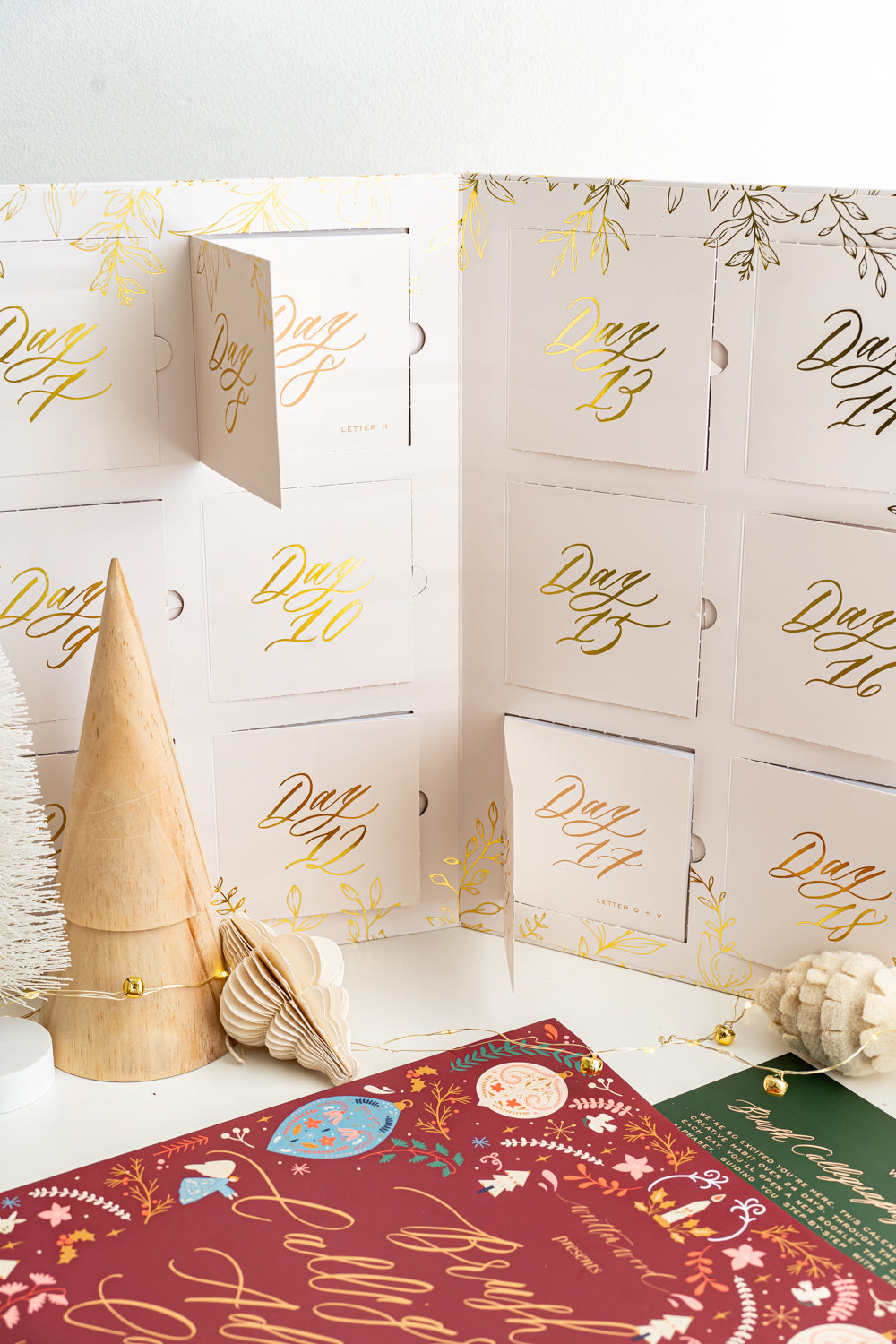 Brush Calligraphy Advent Calendar featuring 24 days of lettering lessons, worksheets, and creative surprises.