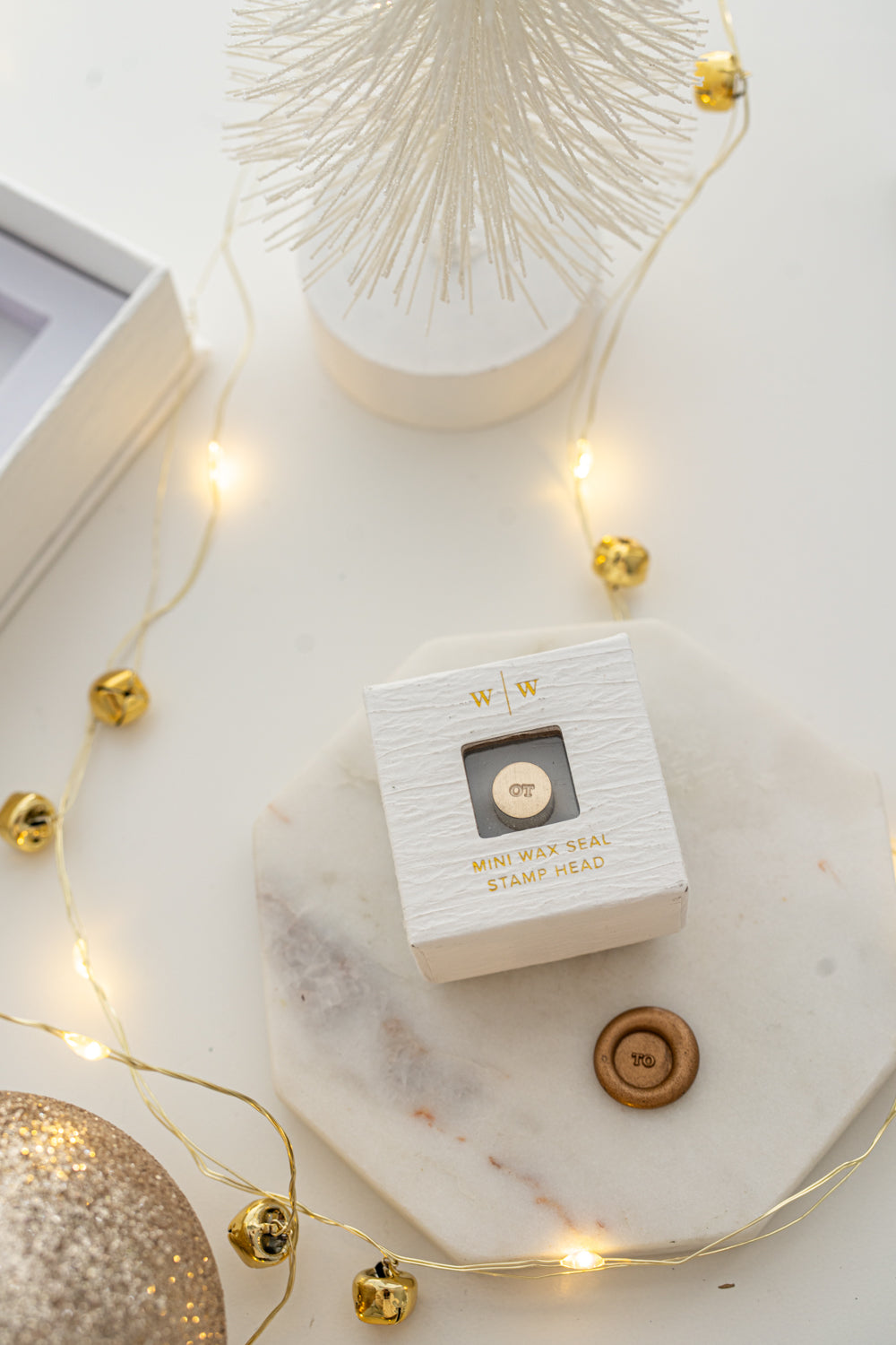 Boxed mini wax seal stamp with “TO” design and gold wax impression, part of Written Word Calligraphy’s Holiday Collection.