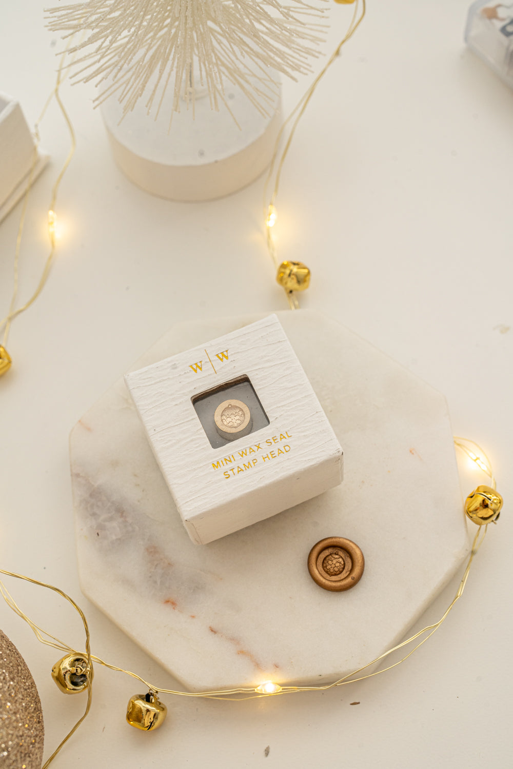 Boxed mini wax seal stamp with round ornament design and gold wax impression, part of Written Word Calligraphy’s Holiday Collection.