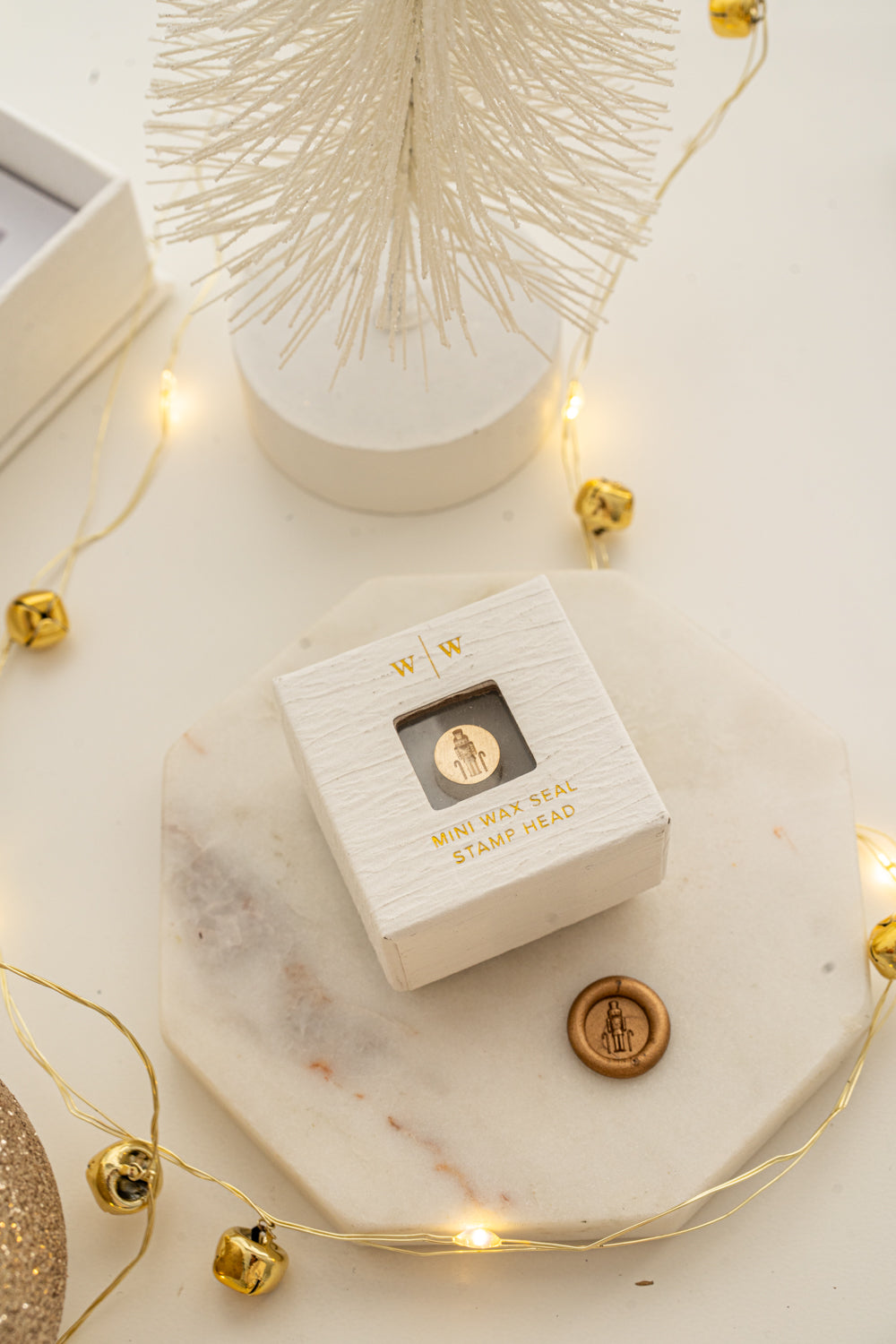Boxed mini wax seal stamp with nutcracker design and gold wax impression, part of Written Word Calligraphy’s Holiday Collection.