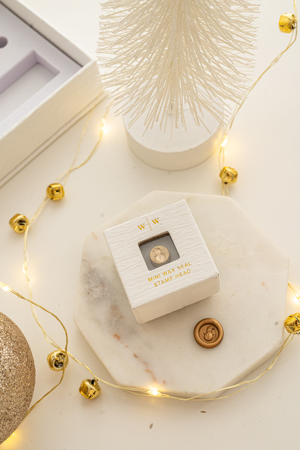 Boxed mini wax seal stamp with snowman design and matching gold wax impression from Written Word Calligraphy’s Holiday Collection.