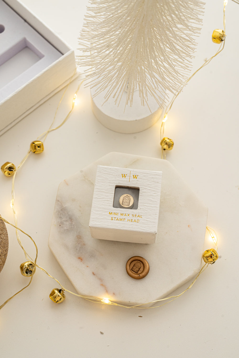 Boxed mini wax seal stamp with gingerbread house design and gold wax impression, part of Written Word Calligraphy’s Holiday Collection.