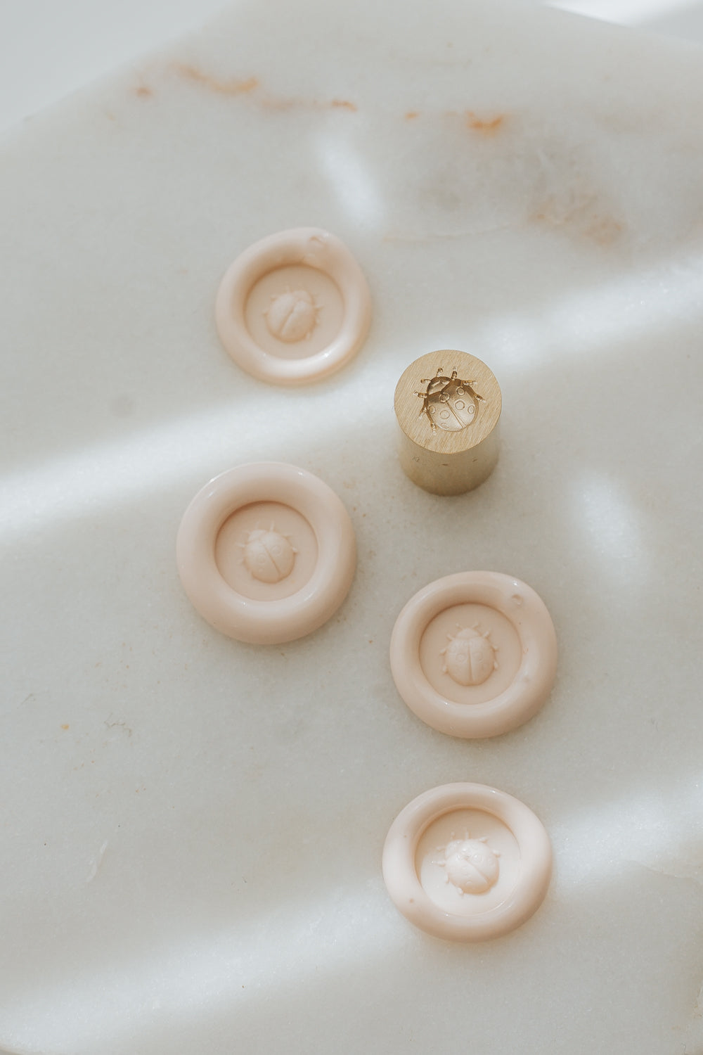 Sakura wax seal impressions with ladybug design and brass stamp head 