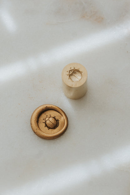 Ladybug wax seal stamp with metallic gold wax seal