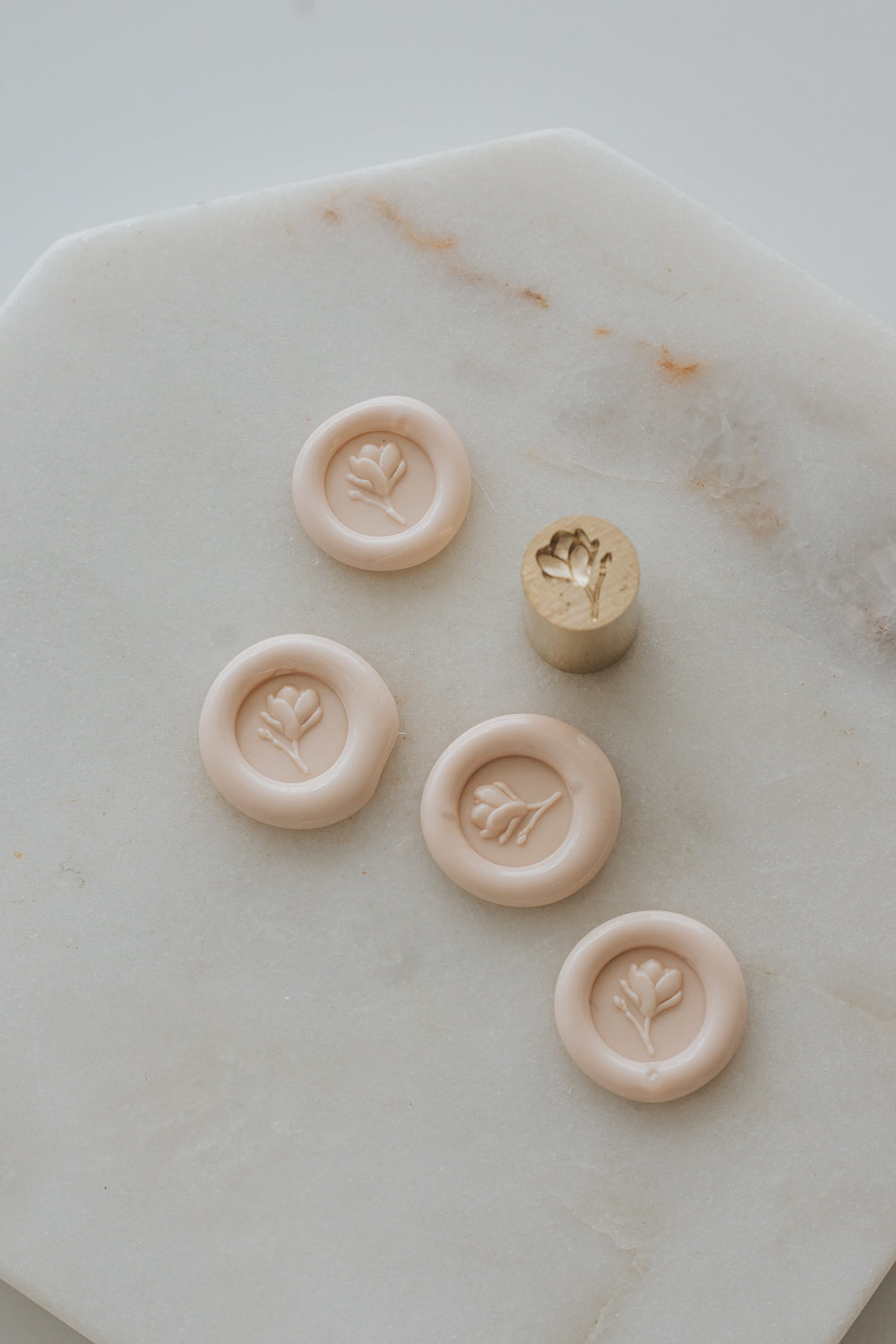 Sakura wax seal impressions with magnolia bud design and brass stamp