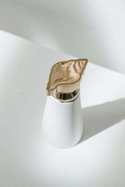 Engraved Conch brass wax seal stamp with white handle for creating elegant wax seals on invitations, envelopes, and gifts.