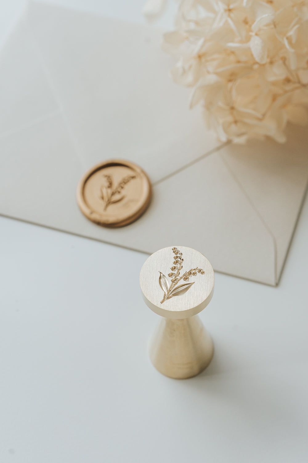 Brass lily of the valley wax seal stamp with gold wax seal for elegant wedding stationery