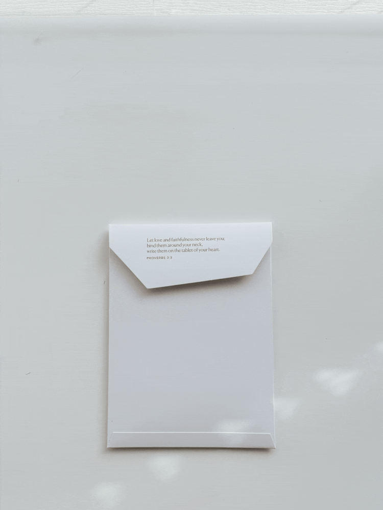 Envelope with printed Bible verse from Proverbs 3:3, minimal Christian snail mail packaging