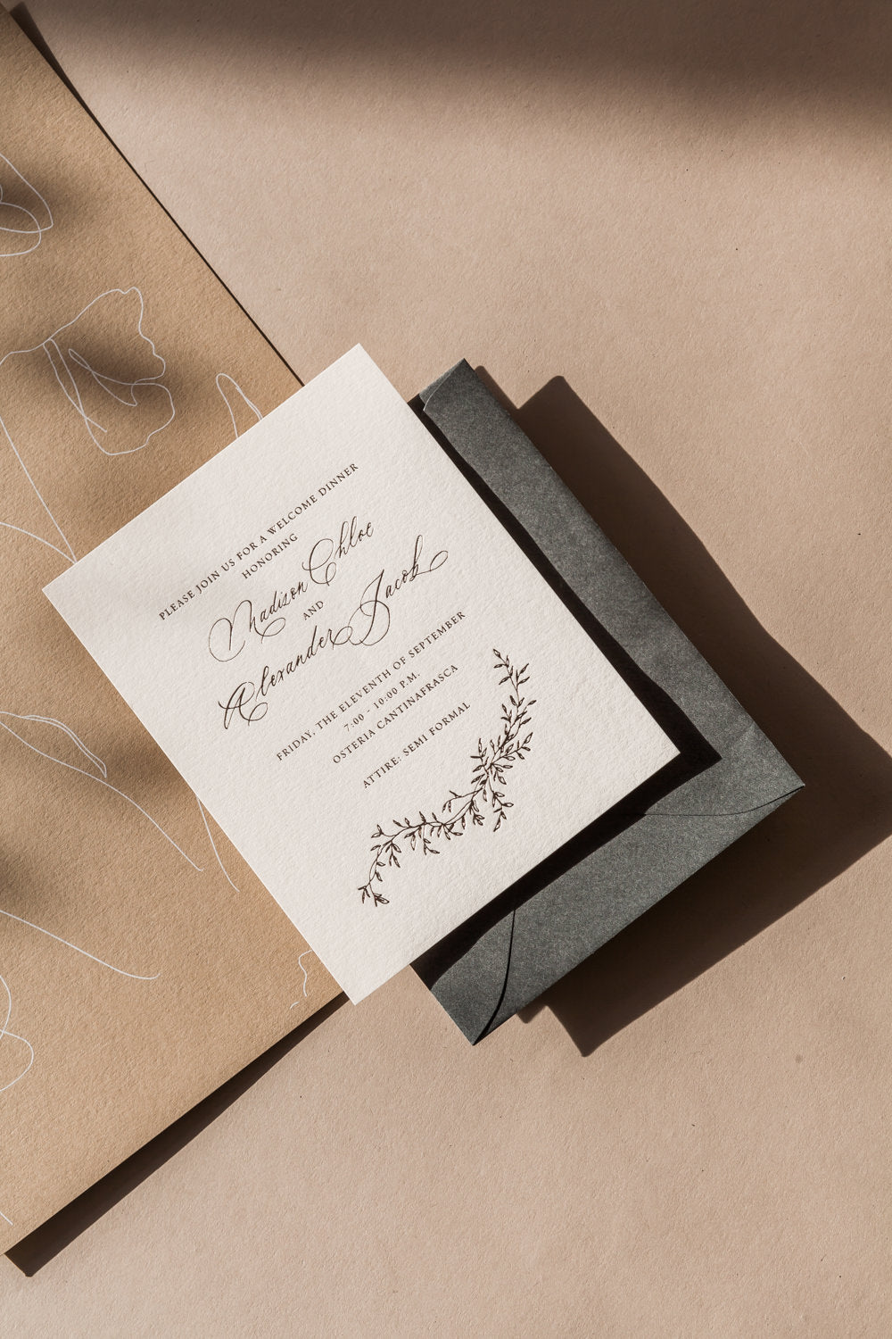 Elegant rehearsal dinner invitation with modern calligraphy names, botanical illustration and neutral envelope styling