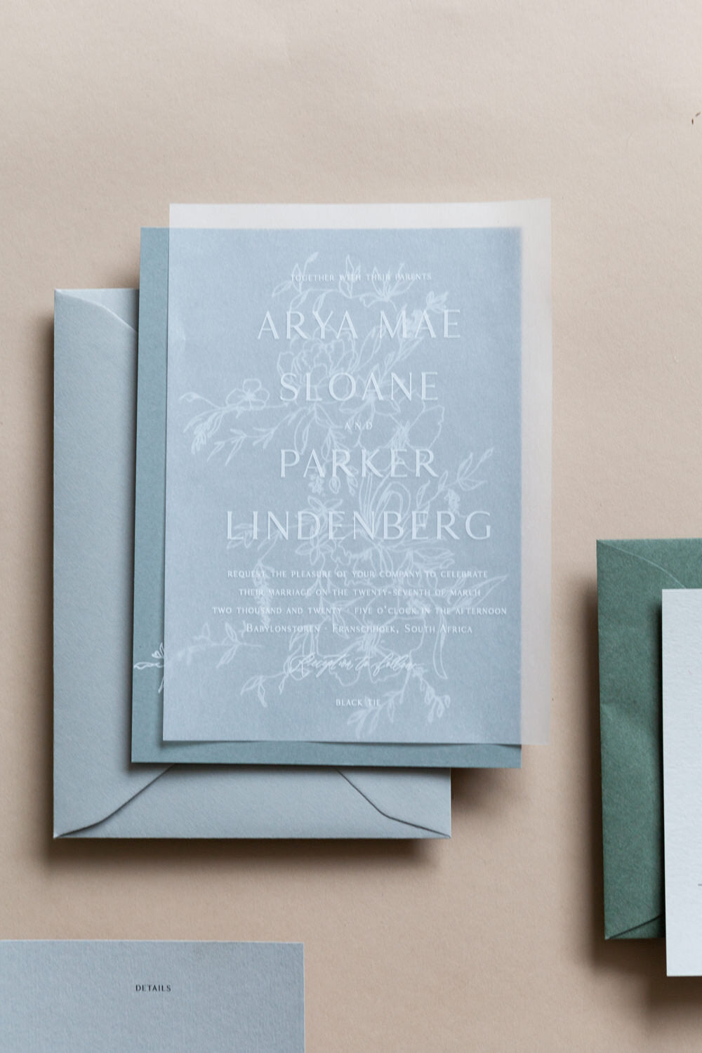 Blue wedding invitation with vellum overlay, minimalist floral design and modern calligraphy stationery suite