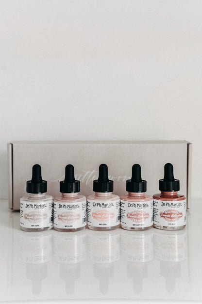Dr. Ph. Martin's exclusive warm tone calligraphy ink set in taupe, blush, coral, dusty rose, and rust colors