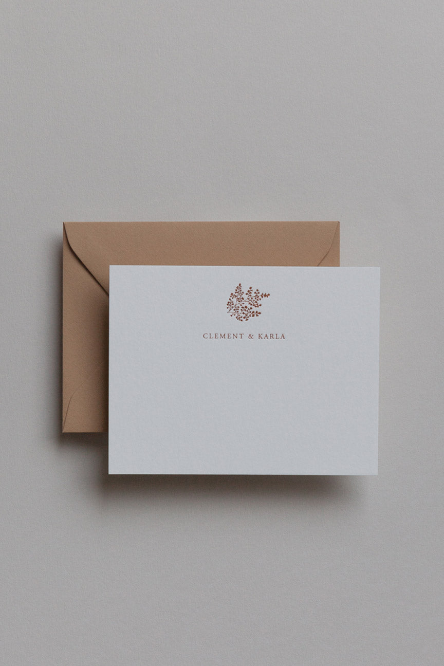 Minimal personalized stationery set with names in serif font on card and kraft envelope
