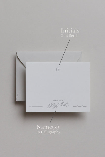 Personalized stationery showing embossed initial and calligraphy name details on custom card