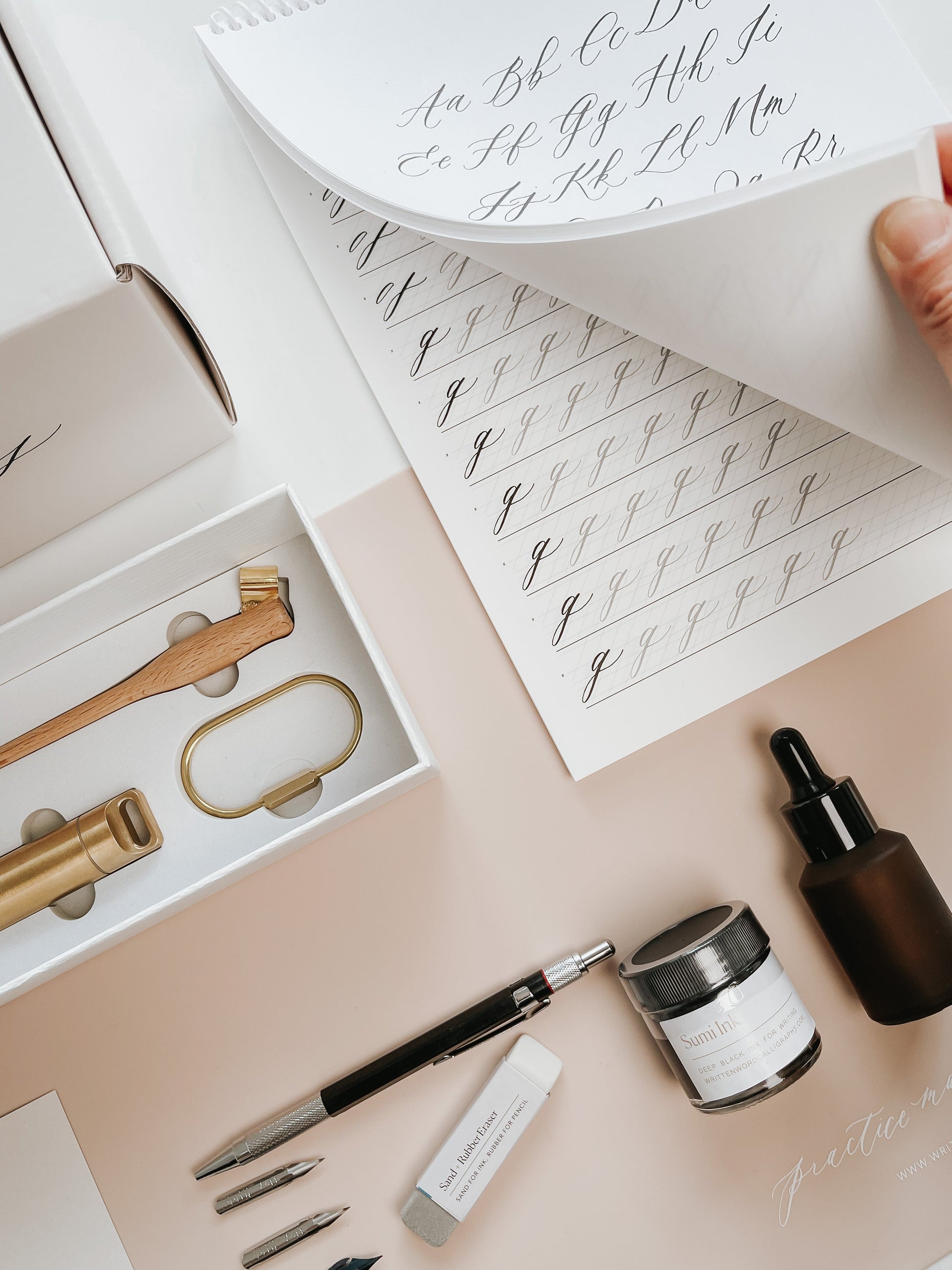 Calligraphy starter kit with nibs, ink, pen holder, guide, and supplies to begin practicing calligraphy