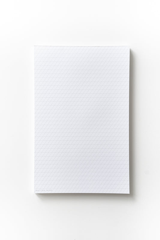 Slanted guide notepad with a 55-degree slant, featuring 50 ink-friendly sheets for calligraphy practice