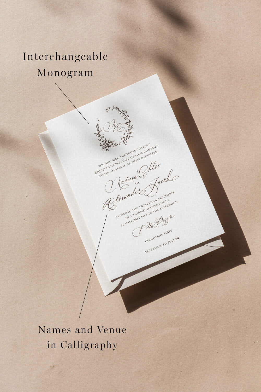 Minimal wedding invitation suite with interchangeable monogram and modern calligraphy names on neutral background