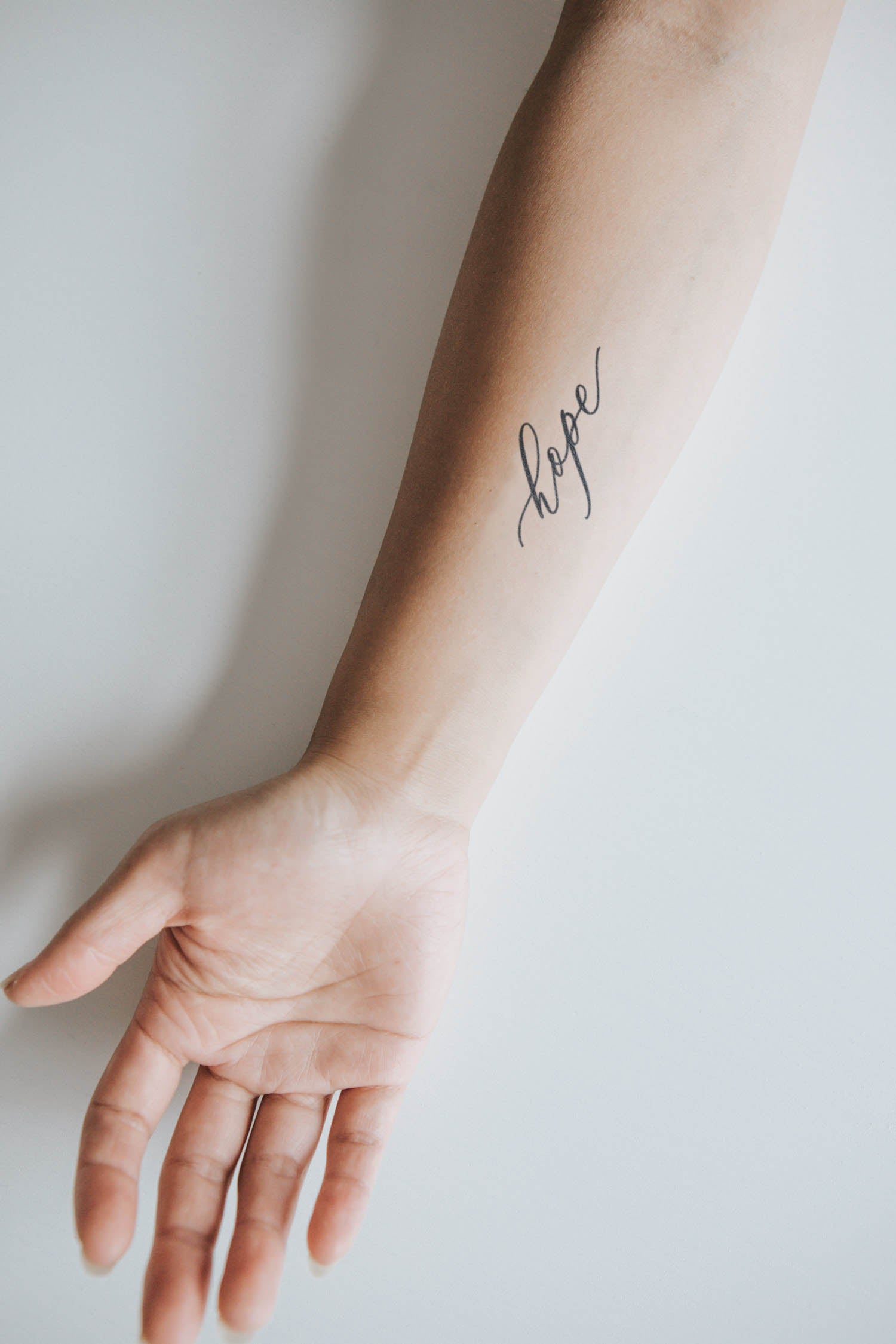 delicate word tattoos